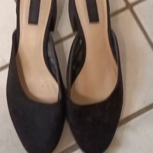 Really cute black slip on. Close toe with open back.